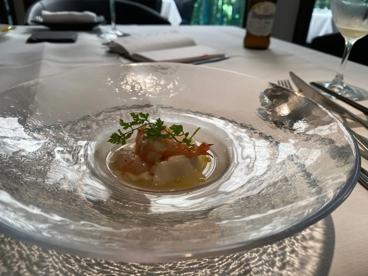 Seafood course plate in a glass bowl at Herlequin Bis