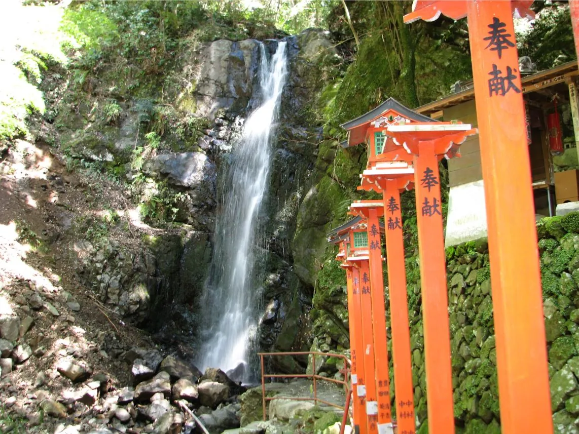 Red torii by the falls