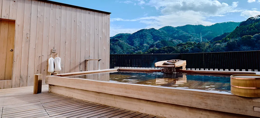 Rooftop open-air bath looking over the valley