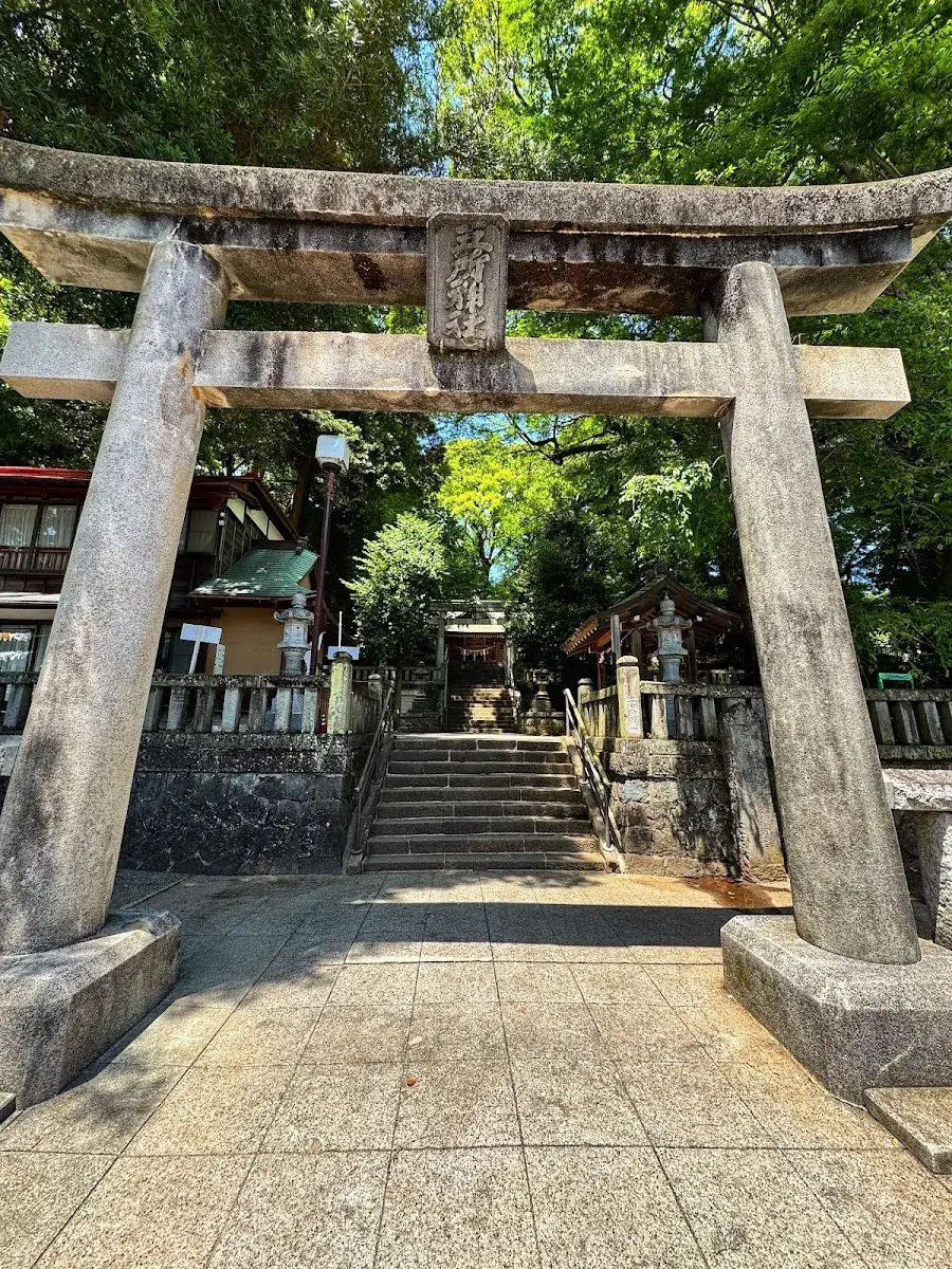 The stone torii at the shrine entrance