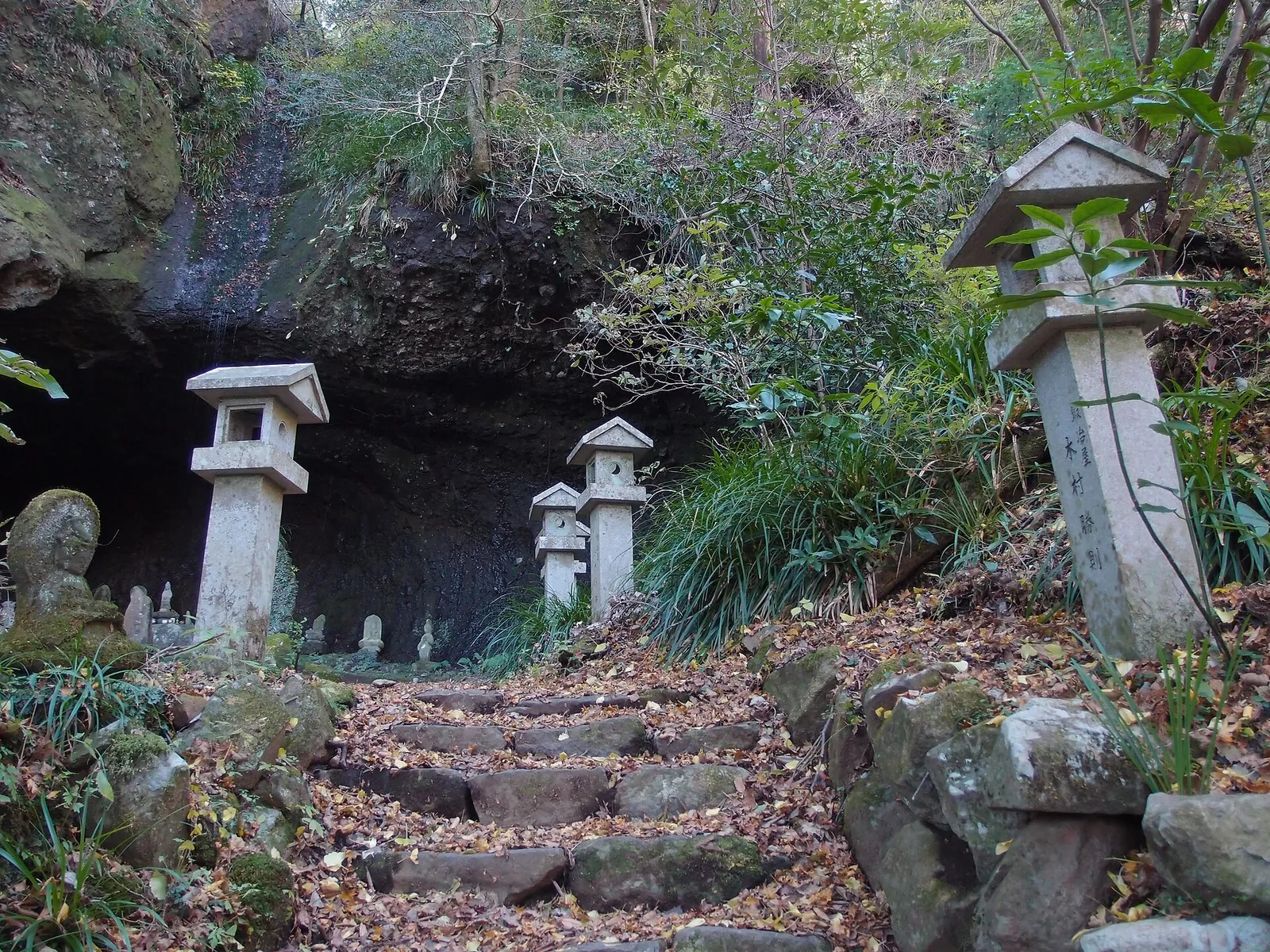 Stone lanterns and steps at the mouth of Shitodo Cave