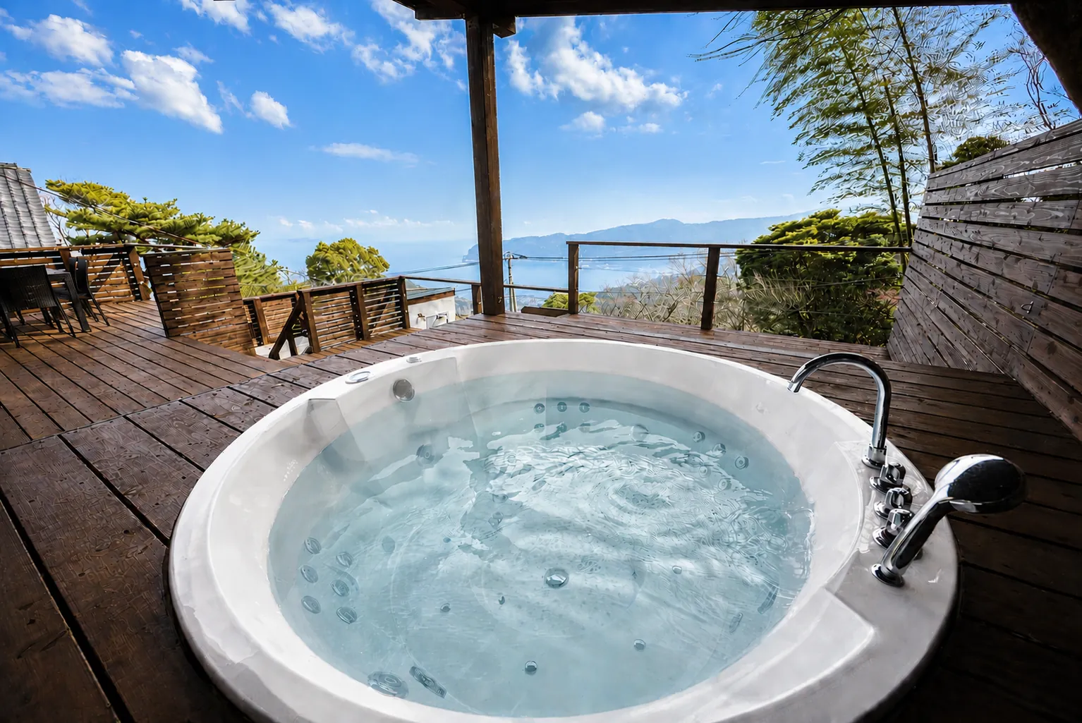 Hot tub on the deck, looking out to sea